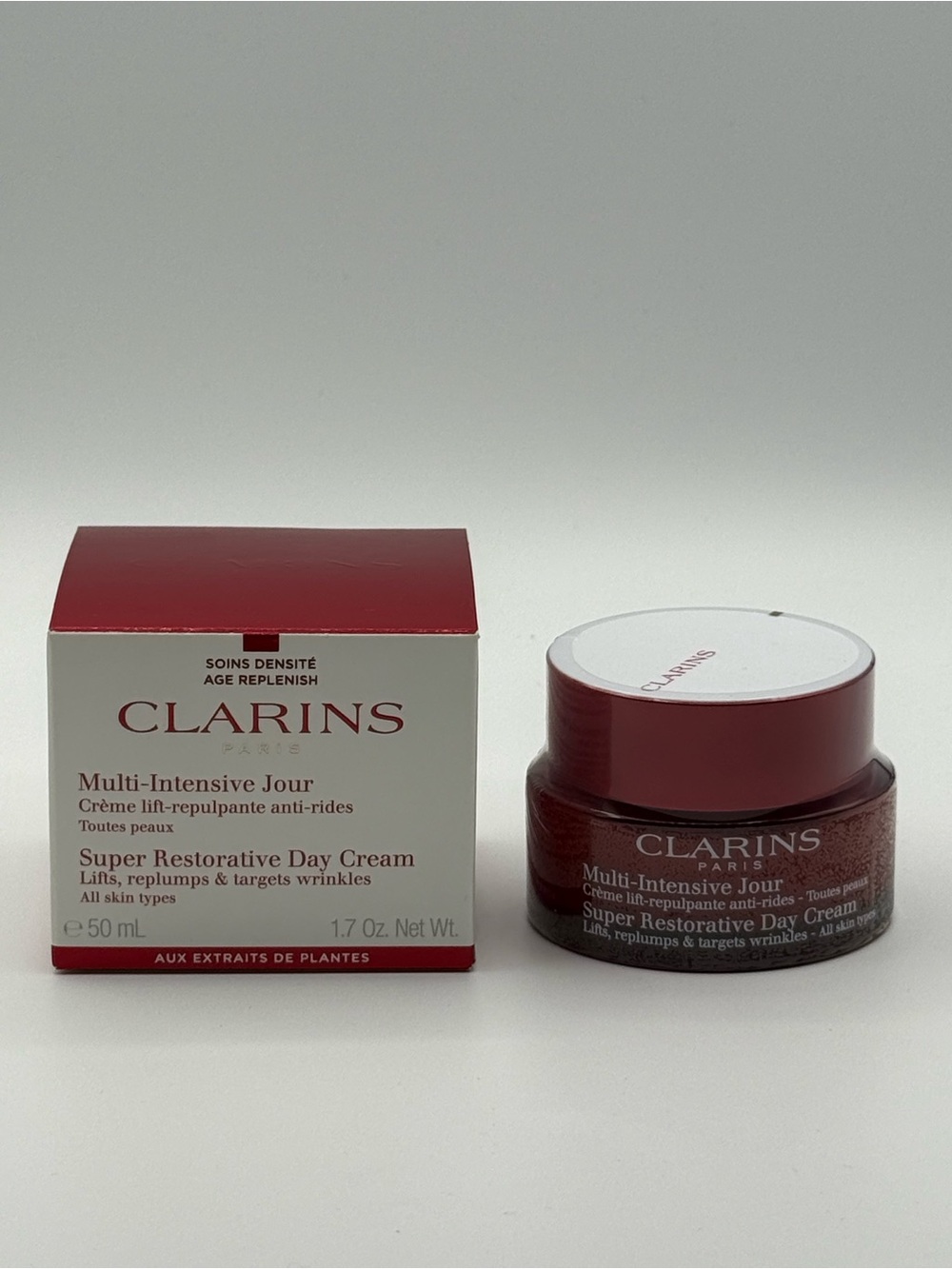 Clarins Super Restorative Day Cream in deep red and white